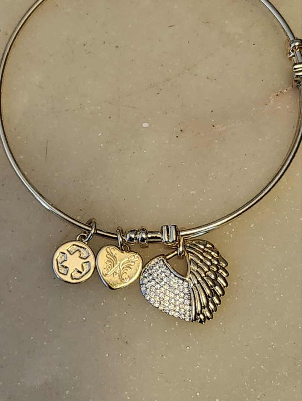 Angelica Gold Tone Pave Crystal Wing Charm Bracelet